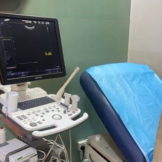 Tomiris, выездная служба УЗИ, логотип