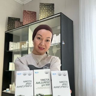 Atomy, логотип
